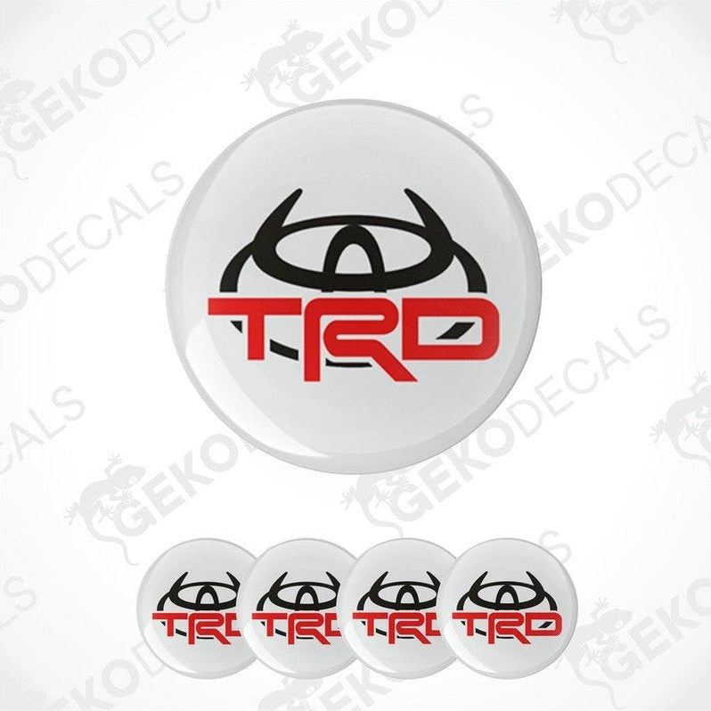 A set of four vinyl decals with the TOYOTA  TRD logo, designed for use on a vehicle's wheels.