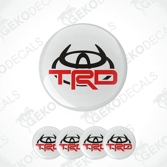 A set of four vinyl decals with the TOYOTA  TRD logo, designed for use on a vehicle's wheels.