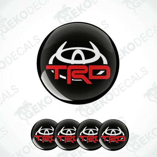 A set of four black, red, and white vinyl decals with the TOYOTA TRD logo.