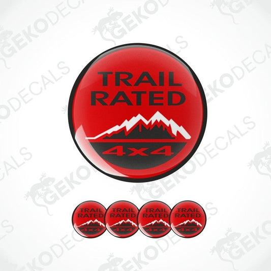A set of four red vinyl stickers with the text 'TRAIL RATED 4X4' and a mountain range design.