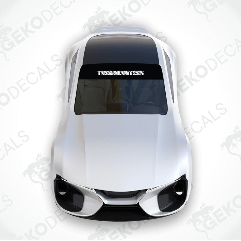 Black car windshield sun visor with white text TURBOHUNTERS