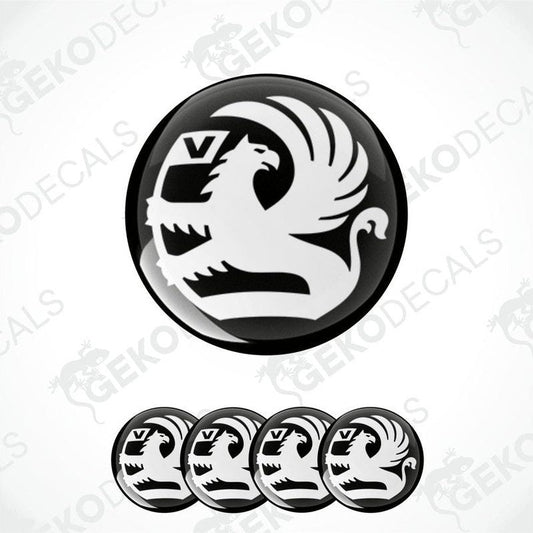 A set of black and white vinyl decals with a polyurethane coating, featuring a bird silhouette and the letter 'V', designed for use on vehicles.