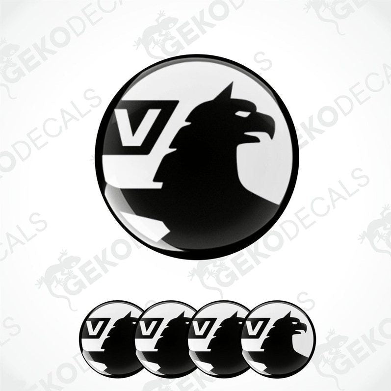A set of black and white vinyl decals with a polyurethane coating, featuring a bird silhouette and the letter 'V', designed for use on vehicles.