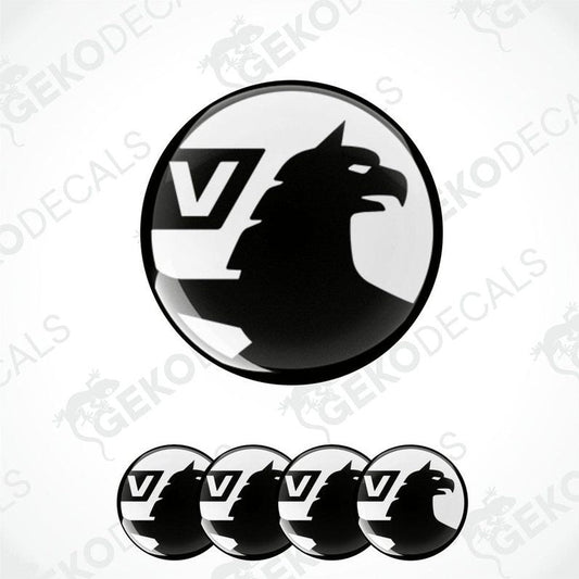 A set of black and white vinyl decals with a polyurethane coating, featuring a bird silhouette and the letter 'V', designed for use on vehicles.