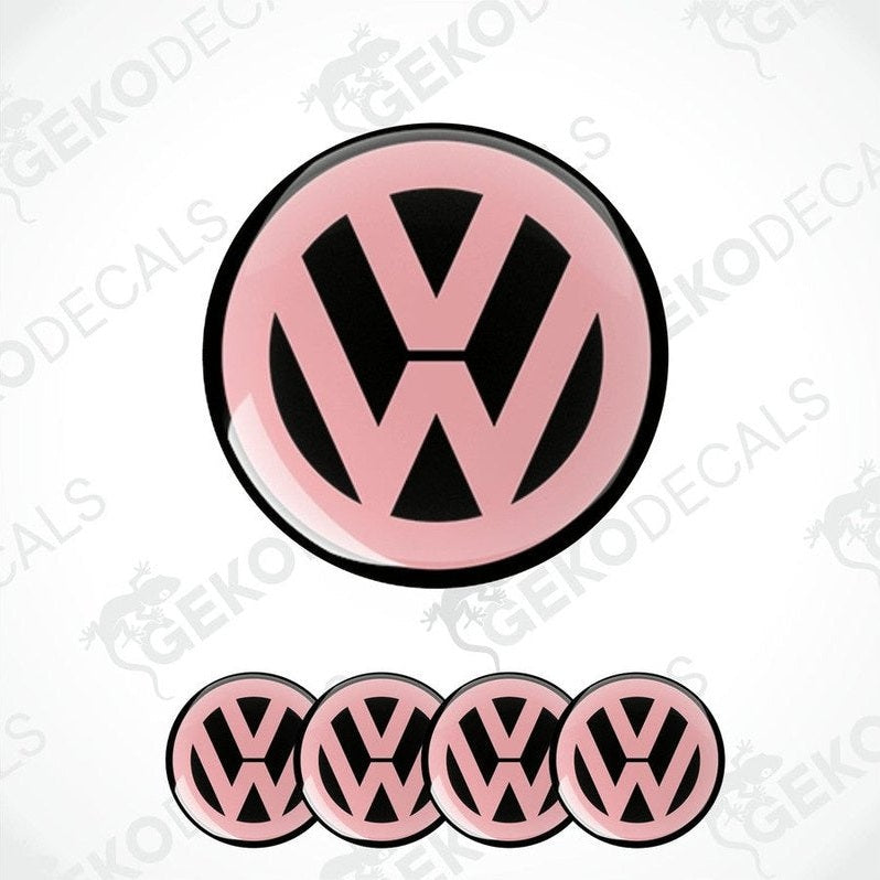 A set of four pink and black vinyl stickers with a dome shape, featuring the Volkswagen logo.