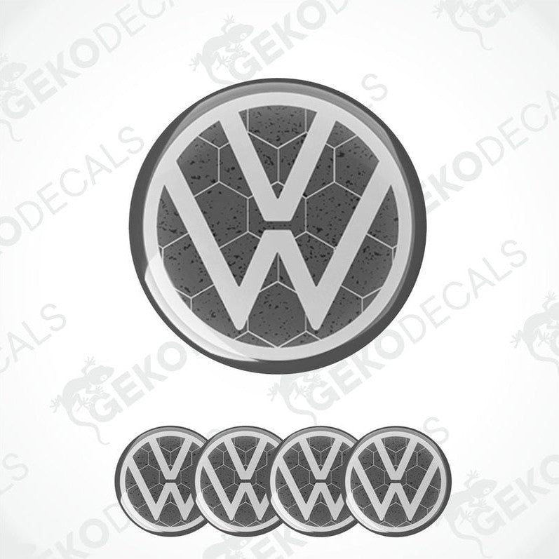 A set of four grey and white volkswagen emblem stickers with a dome shape and a polyurethane coating.