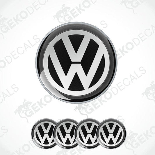 A set of four black and white dome-shaped vinyl decals with the Volkswagen logo.