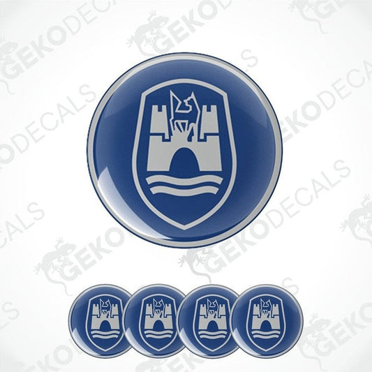 A set of four blue and grey vinyl stickers with a castle-like design and the brand name 'VOLKSWAGEN' on them.