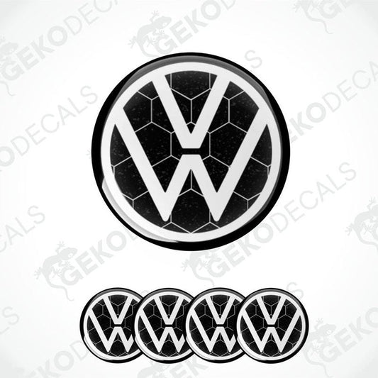 A set of four black and white volkswagen emblem stickers with a dome shape and a polyurethane coating.