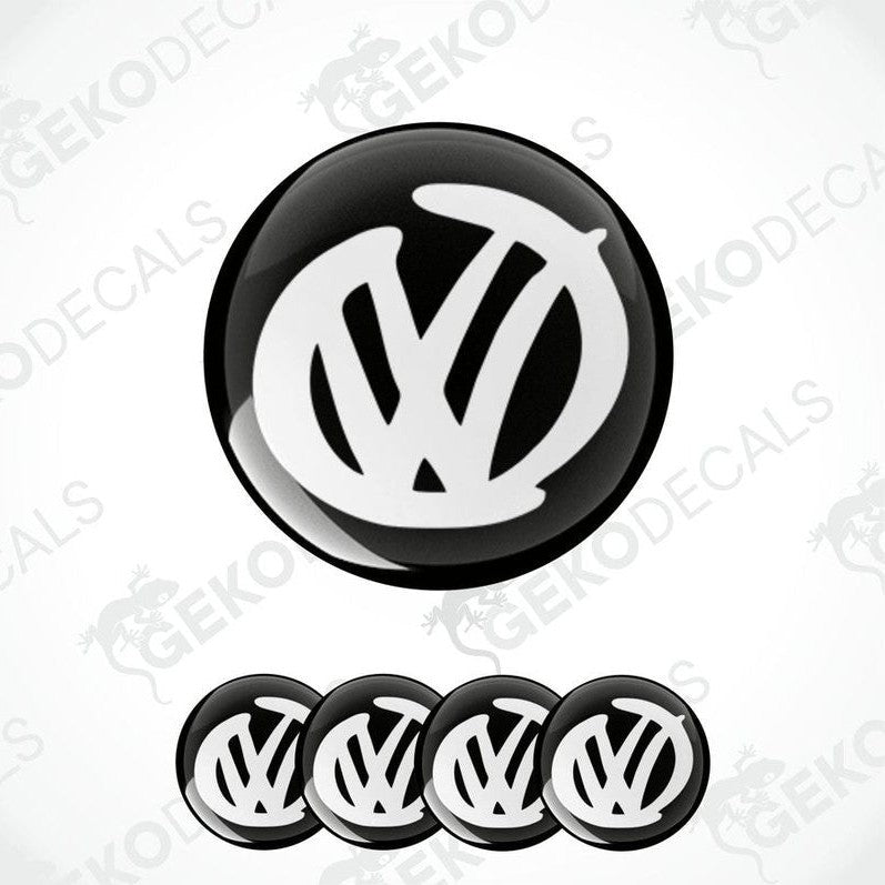 A set of four black and white volkswagen emblem stickers with a dome shape, displayed against a white background.