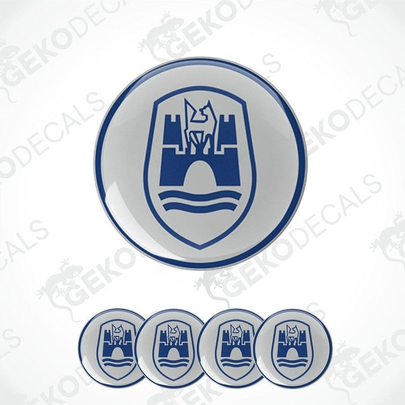 A set of four blue and white vinyl stickers with a castle-like design and the brand name 'VOLKSWAGEN' on them.