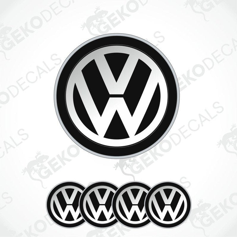 A set of four black and white dome-shaped vinyl decals with the Volkswagen logo.