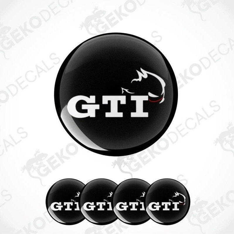 A set of four black vinyl stickers with the letters 'GTI' and a graphic design, displayed on a white background.
