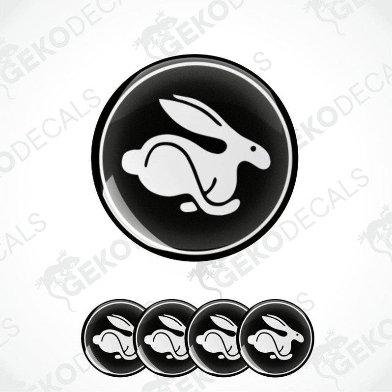 A set of vinyl decals featuring a white Volkswagen rabbit on a black background, designed for use as car stickers.
