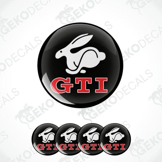 A set of four black vinyl stickers with a white rabbit and red GTI logo design.