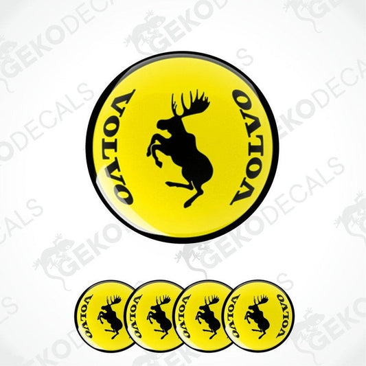 A set of four yellow vinyl stickers with a black silhouette of a moose and the brand name 'VOLVO' in bold letters.