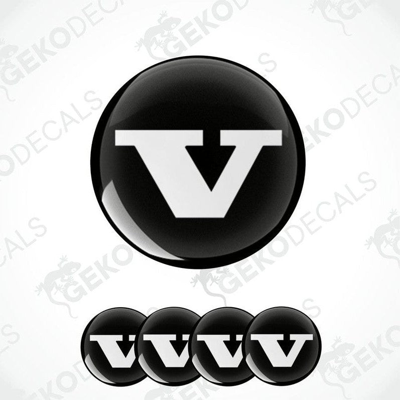 A set of four black vinyl stickers with a bold letter 'VOLVO' in the center, arranged on a white background. The stickers have a glossy finish.