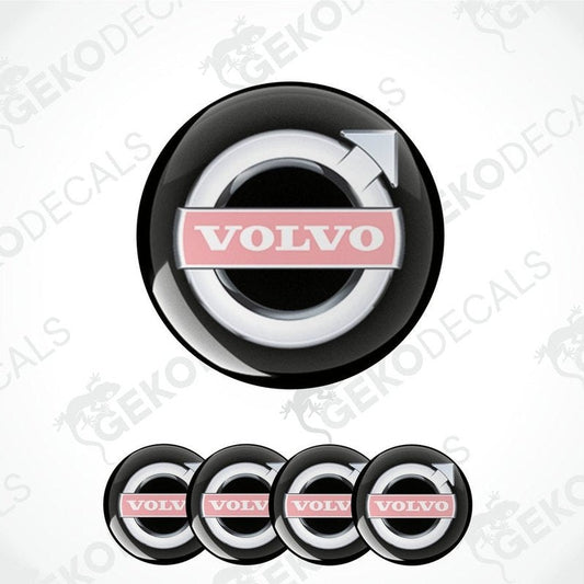 A set of four black vinyl stickers with the Volvo brand logo in white and pink.