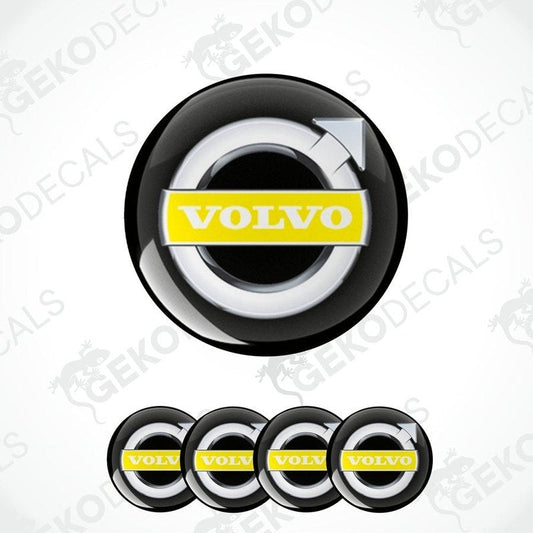 A set of four black vinyl stickers with the Volvo brand logo in white and yellow.