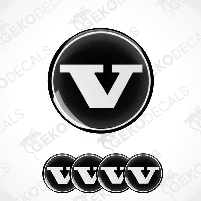A set of four black vinyl stickers with a bold letter 'VOLVO' in the center, arranged on a white background. The stickers have a glossy finish.