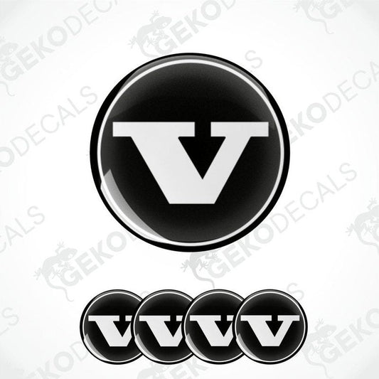 A set of four black vinyl stickers with a bold letter 'VOLVO' in the center, arranged on a white background. The stickers have a glossy finish.