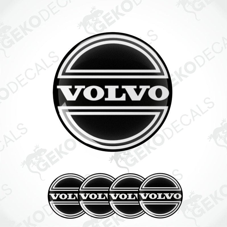 A set of four black vinyl stickers with the Volvo brand logo on them.