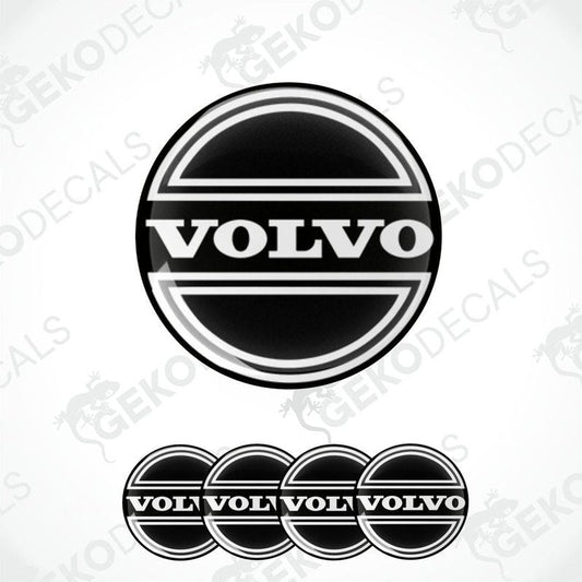 A set of four black vinyl stickers with the Volvo brand logo on them.