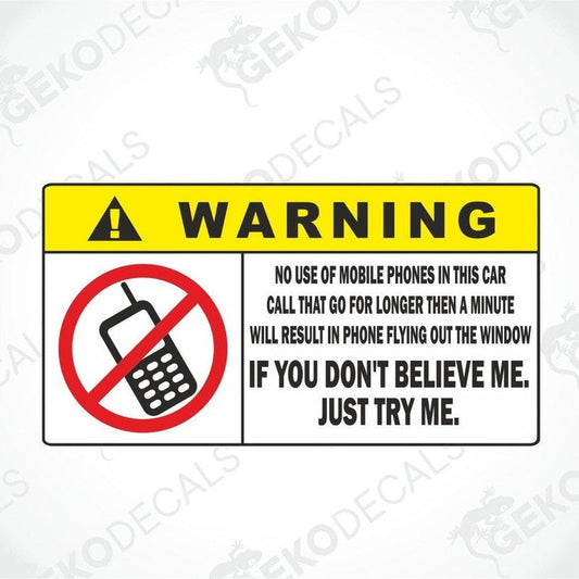 A yellow and black warning sticker with text and a no mobile phones icon.