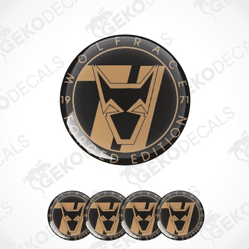A set of circular vinyl stickers with a black, gold, white, and black again color scheme. The stickers feature a WOLFRACE logo.